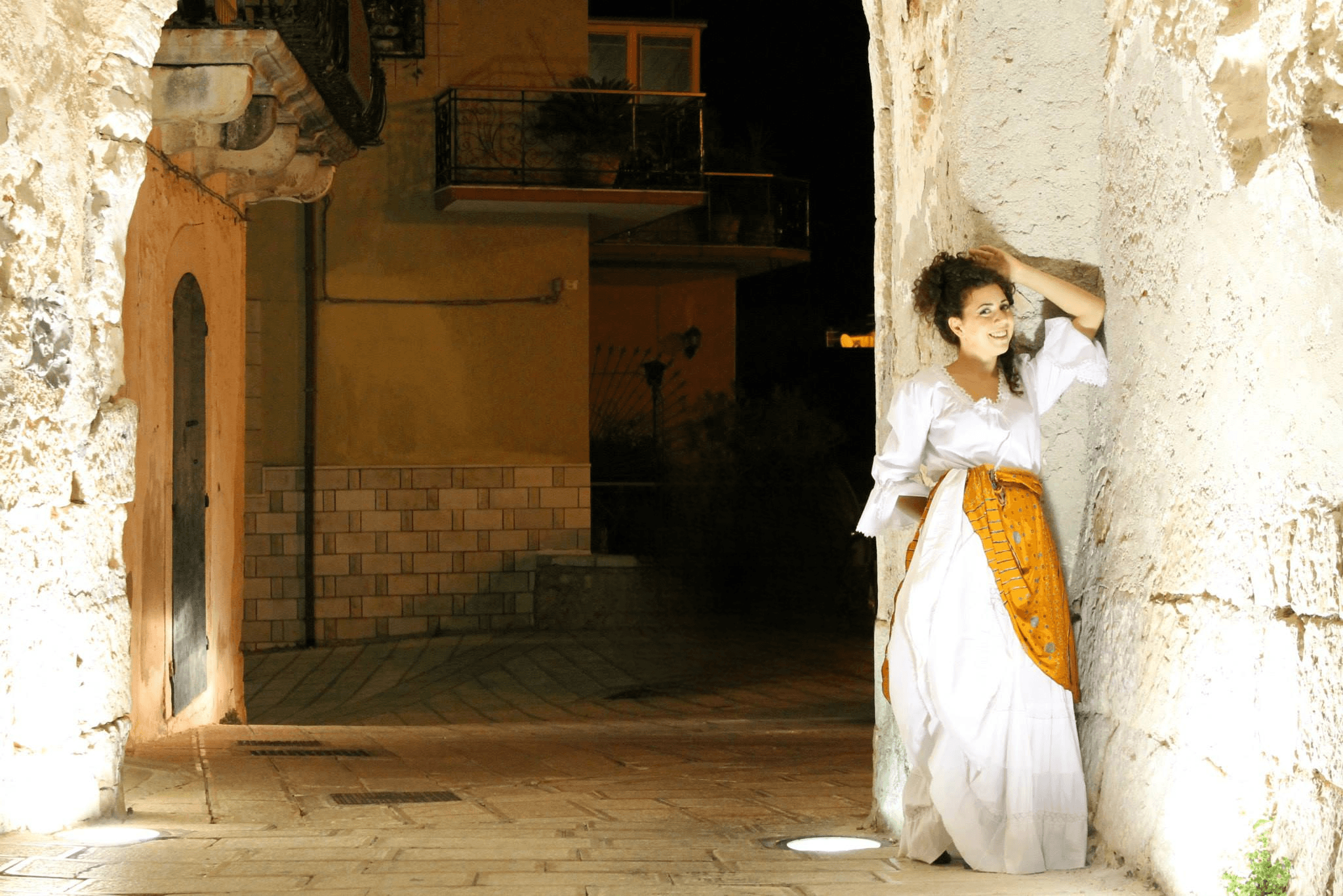 Maira Opera in Puglia, Italy — ancient stone arch at night